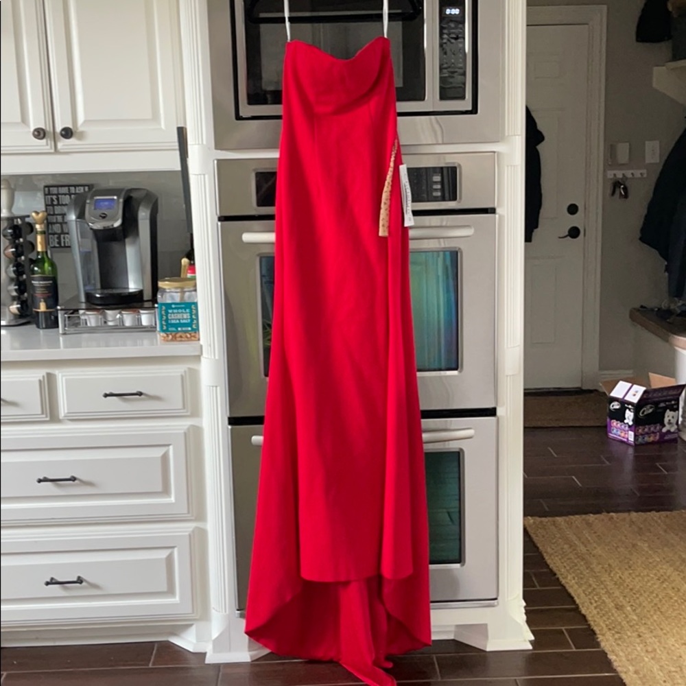 Sherry hill red strapless prom dress with leg slit